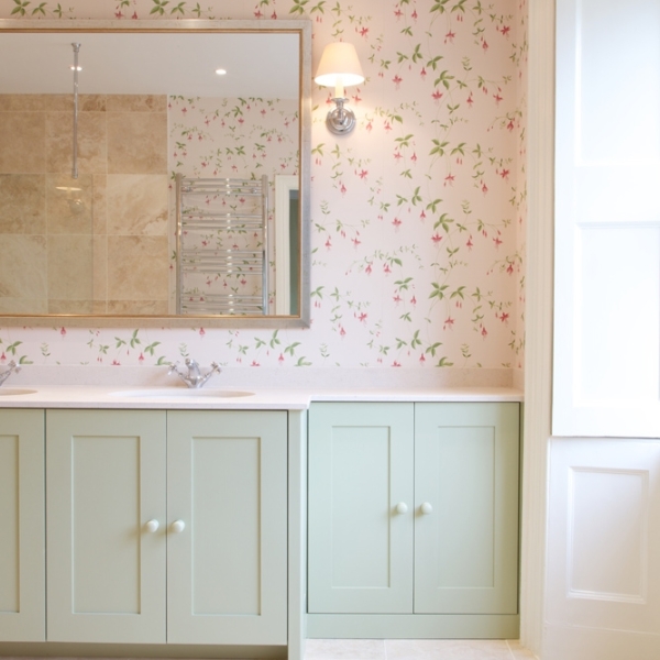 Statement wallpaper and bespoke vanity unit in the bathroom